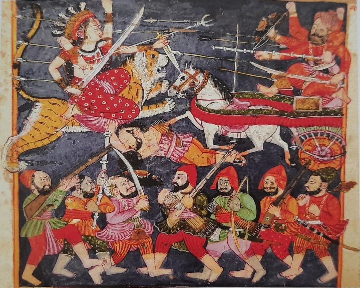 The goddess on her lion cuts through a demon army with chariot and foot soldiers, in a dispersed Devi Mahatmya folio.